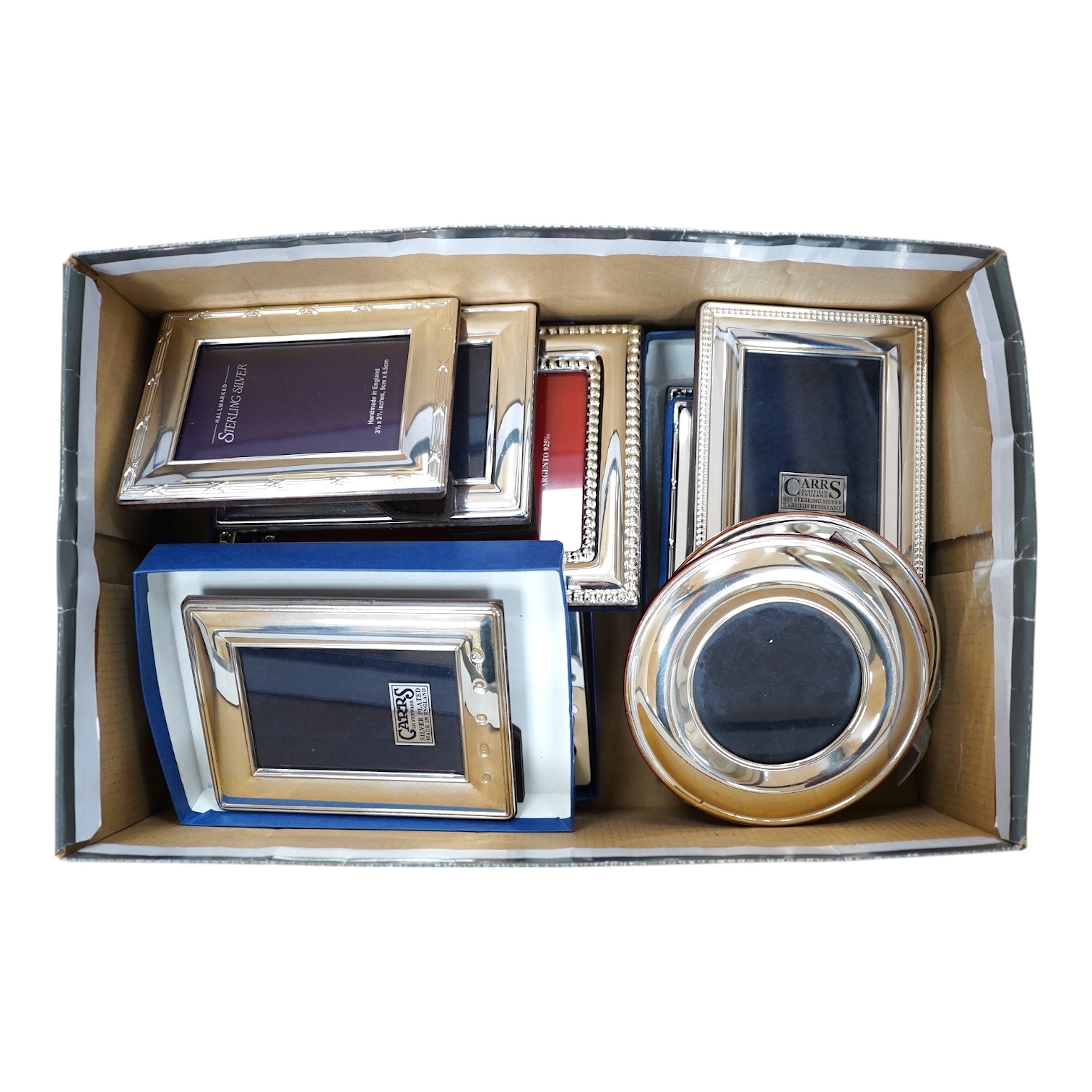 Six assorted modern Carr's of Sheffield silver mounted photograph frames, largest 12.9cm, three silver plated frames and three Italian sterling mounted frames. Condition - good